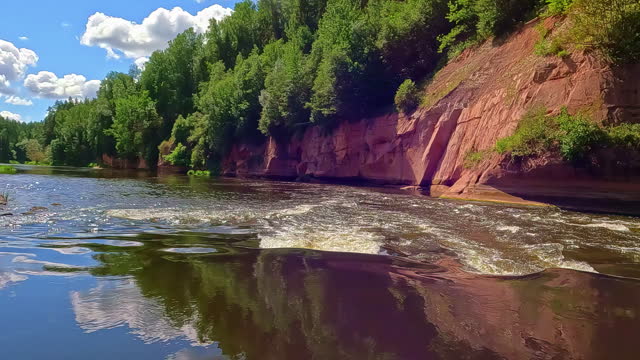 Gauja River in Gauja National Park in Vidzeme, Latvia - canoe pint of view