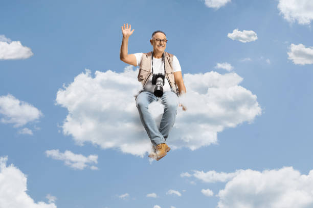 Asian man on outdoor backpacking jumps in the desert.