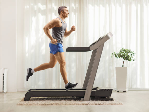 istock Fit young man running on a treadmill 2148393738