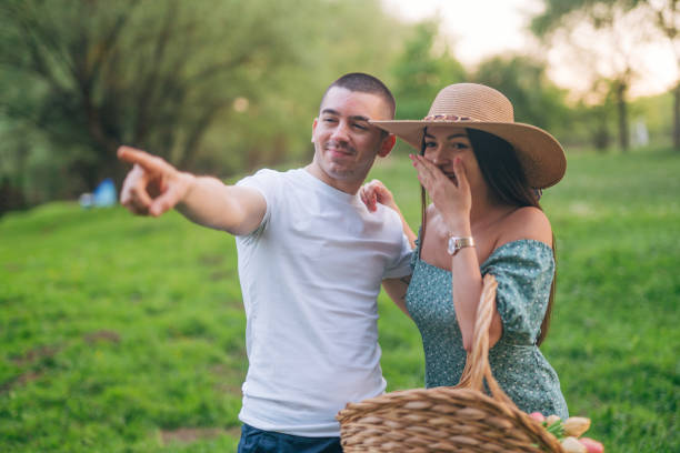 istock Happy smiling couple walking in nature and looking around. 2148394285