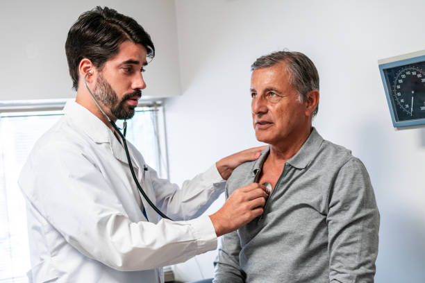 istock Caring Doctor Performing Checkup On Senior Male Patient 2148395323