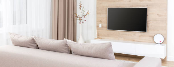 Panoramic picture of a spacious living room full of light