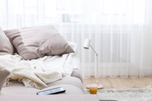 istock Comfortable sofa by the window at home. Freelance concept 2148397471