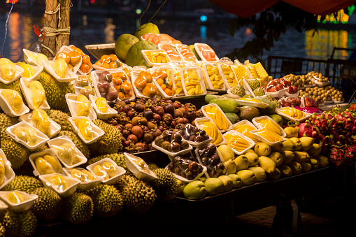 Vietnam night street food market with many fruits