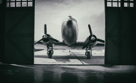 World War II era fighter plane in a hangar