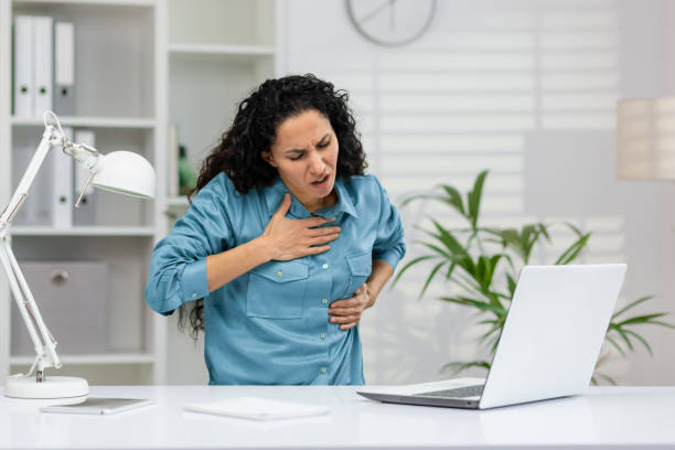 istock Woman experiencing chest pain while working at the office 2148401109