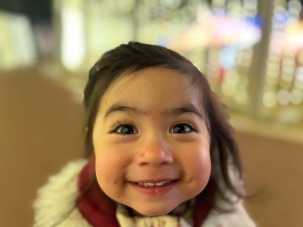 istock Little child admiring Christmas lights 2148401963