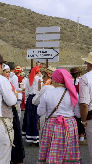 El Pajar, Gran Canaria, Canary Islands, Spain - April 6, 2024 - Romeria de Santa Agueda - The road sign perfectly indicates the location of the ongoing procession