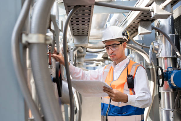 istock Engineers are inspecting a large building or industrial facility's cooling system for the air conditioning. 2148404388