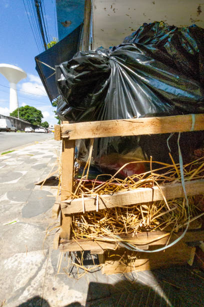 Garbage with plastic bags and wood thrown on the street