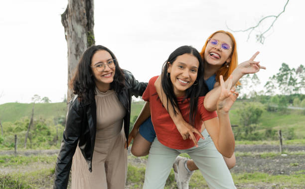 istock small group of happy women smiling outdoors and making gestures with their hands and face 2148409499