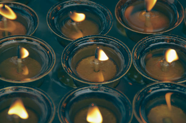 istock Overhead view of lit tibetan brass ghee lamps 2148409913