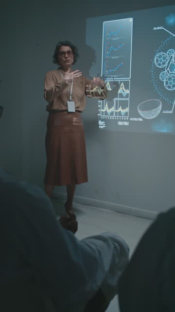 Caucasian Female Scientist Presenting Research to Doctors at Meeting