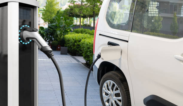 istock Electric delivery van with electric vehicles charging station 2148411575