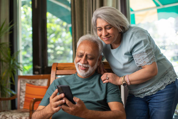 istock Senior couple using social media over cellphone at home 2148411661
