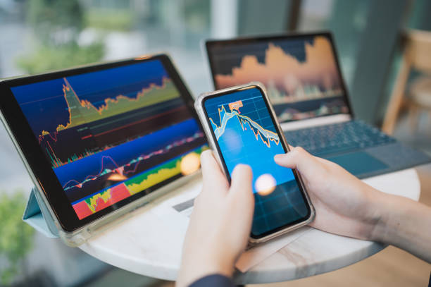 istock Modern Gen-Z Millennial asian using smartphone checking investment portfolio on mobile application outdoor 2148413954