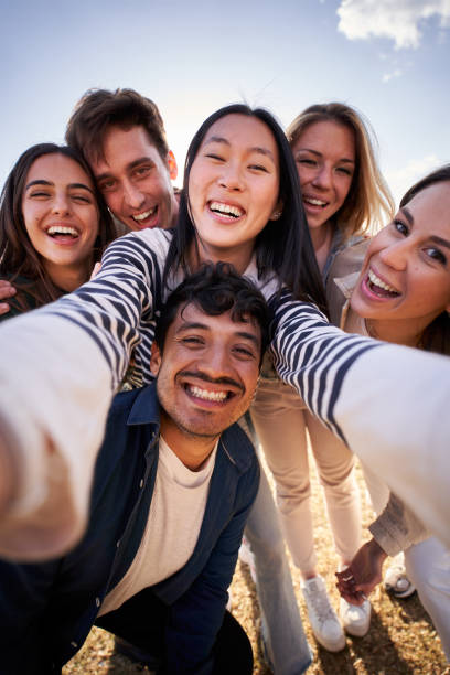 istock Group diverse happy young friend taking selfie together looking smiling at camera. Piggyback people. 2148414340