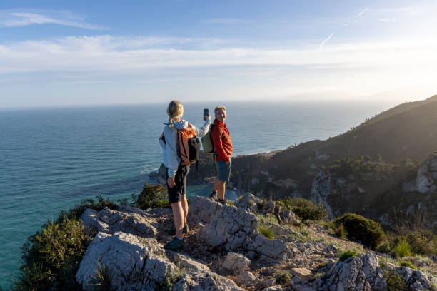 istock Mature couple take photo at coastal viewpoint 2148414737