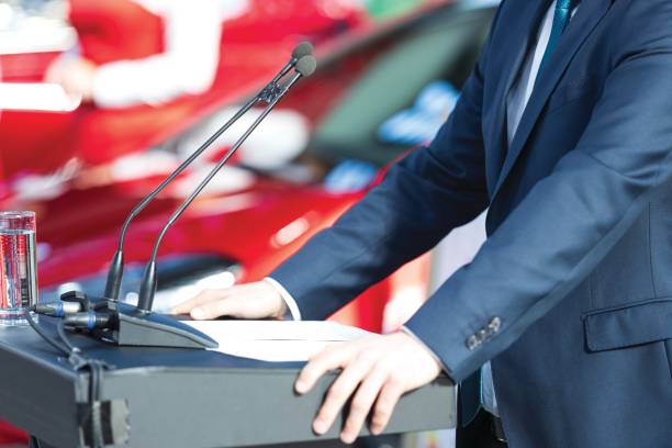 Public speaker at business conference, corporate presentation, workshop, coaching training, news conference, company meeting, public or political event. Public speaking concept.