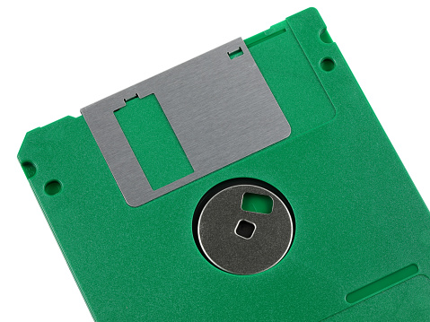 Flexible magnetic disc in a flat square case. With a capacity of 1,44 MB and a diameter of 3,5 inches, it is designed to store digital data that can be read and written using a suitable drive.