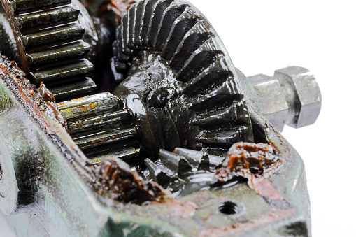 Detail of the transmission mechanism from the crank to the chuck of an old hand drill. Worn grease can be seen on the gears of this unit.