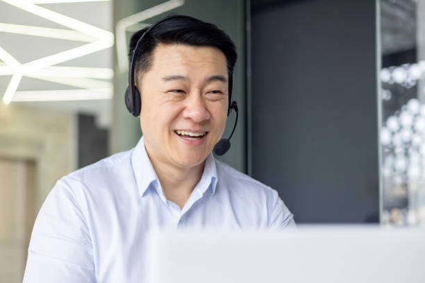 istock Focused Asian businessman working in modern office 2148416871