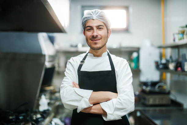 Portrait of a chef in restaurant kitchen.