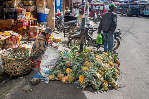 London, UK - 3 November, 2020 - Pineapples (ananas) displayed for sale at Walthamstow Market, allegedly the longest market in Europe