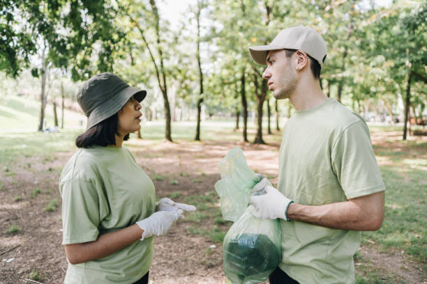 istock Young volunteers recycling at the public park 2148418132