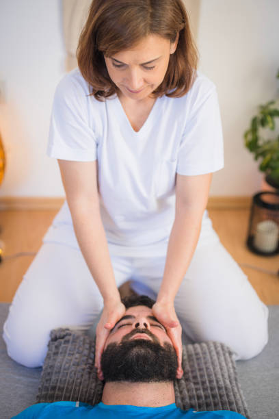 istock Therapist providing patient face massage 2148420822
