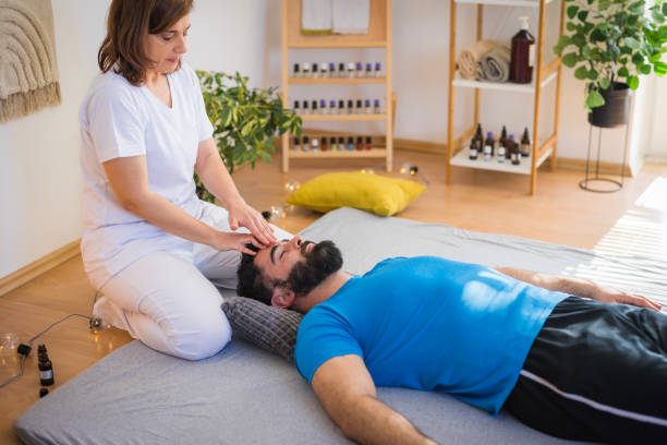 istock Man enjoying shiatsu face massage 2148420926