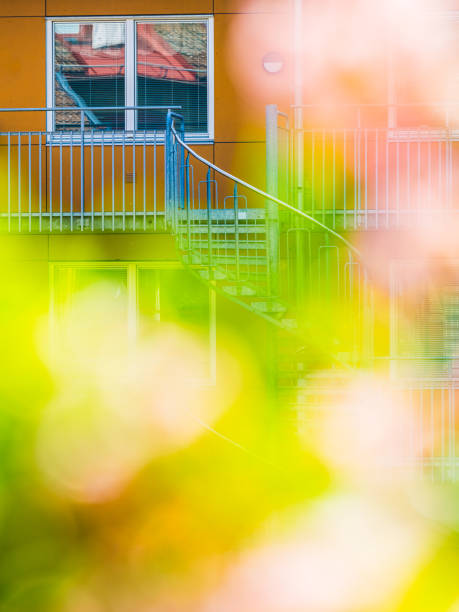 A blurry shot capturing a building with stairs leading up to a flat in Molndal, Sweden. The focus is on the architectural details and the ascending staircase.