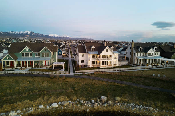 Aerial view of a community of luxury homes, taken at sunrise.