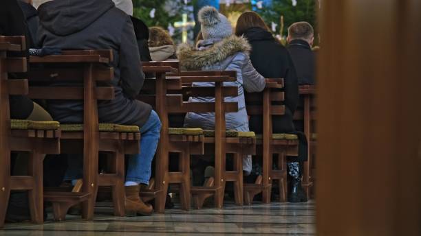Anonymous People Praying in Catholic Church During Sunday Holy Mass Service