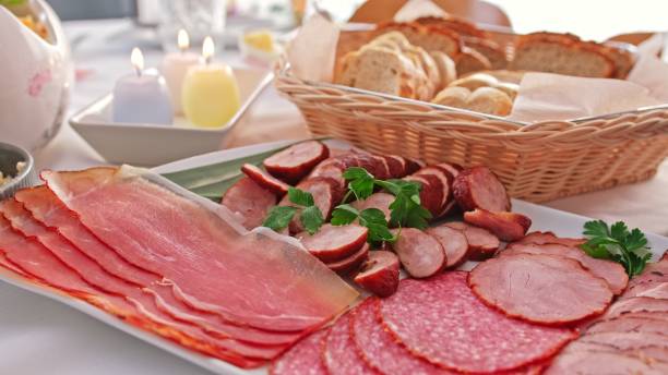 Table Set for Easter Celebration Breakfast with Tasty Sliced Bread and Ham Cold Cuts