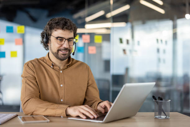 istock Professional man working on laptop in modern office 2148425488