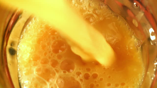 Super slow motion Fresh tangerine juice