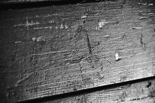 a wooden panel that covered a carriage that deported Jews. The scratches of the deportees can still be seen
