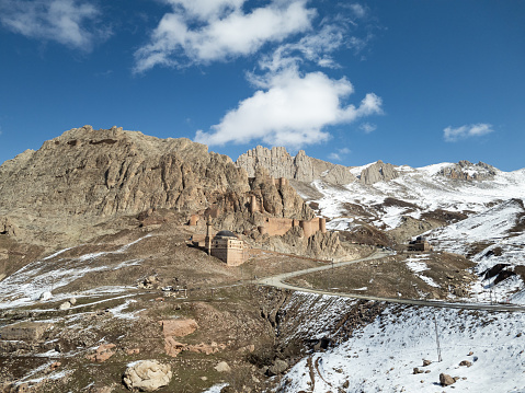 Dogubayazıt, Turkey, Middle East: panoramic and breathtaking view of the ancient castle of Old Beyazit near the famous Ishak Pasha Palace and Eski Bayezid Cami mosque, on the road up to the mountains