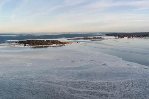 Area of the Viimsi Puunsi peninsula, frozen sea, photo from a drone in winter. High quality photo