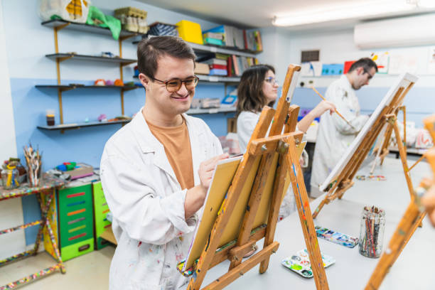 istock Inclusive Art Class with People with Disabilities Enjoying Creativity 2148429224
