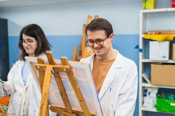 istock Joyful Art Session in a Painting Class for People with Disabilities 2148429685