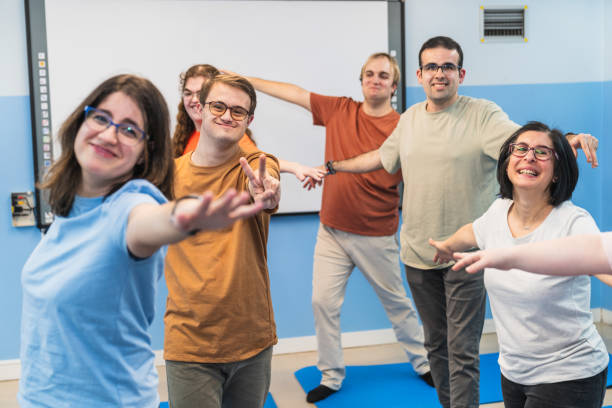 istock Joyful Yoga Moment With Open Arms Including Down Syndrome Students 2148430058