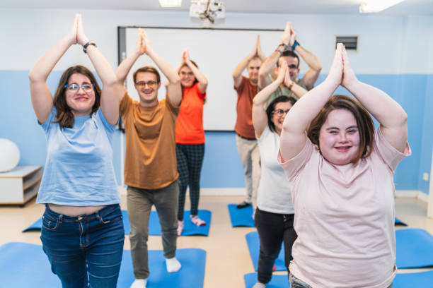 istock Front View of Inclusive Yoga Class Celebrating Down Syndrome Participation 2148430165