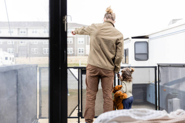 istock Unrecognizable hipster dad takes daughter out on RV deck 2148430169