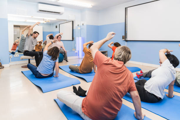 istock Group of People with Disabilities Enjoying a Yoga Pose 2148430707