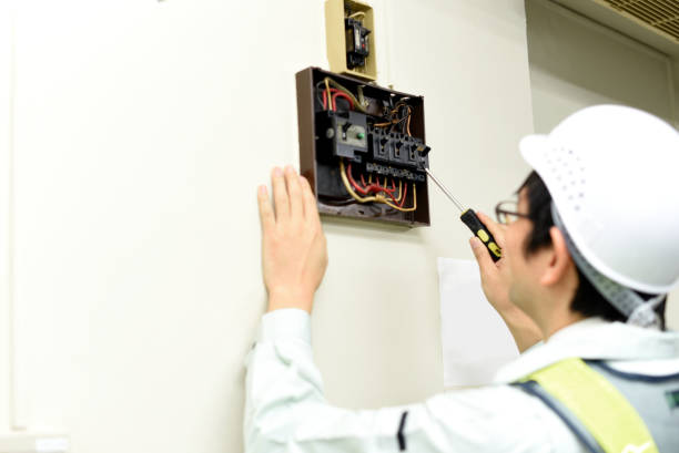 istock Rear view of an Asian man wearing work clothes and inspecting electronic circuits 2148433877
