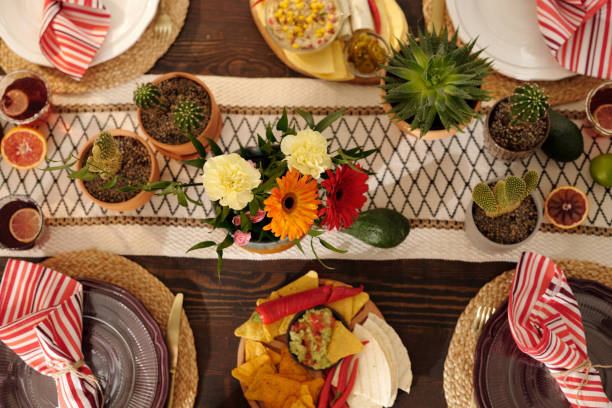 istock Festive table with flowers and plates 2148435258