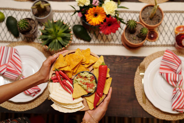 istock Woman holding tray with tasty snacks 2148435272