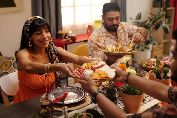 istock Happy girl taking snacks over table 2148435288